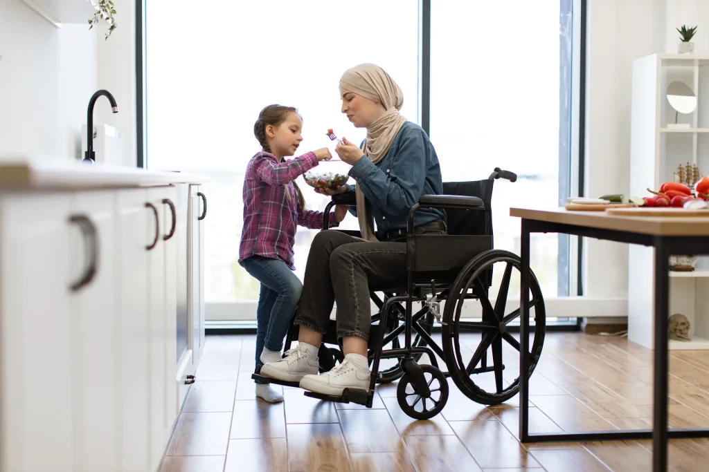 Disabled woman in wheelchair with daughter